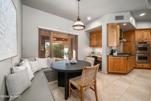 dining space featuring light tile patterned flooring