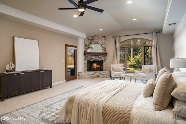 bedroom with vaulted ceiling, a fireplace, light colored carpet, access to exterior, and ceiling fan