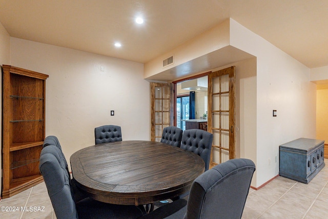 dining room featuring french doors, light tile patterned floors, recessed lighting, visible vents, and baseboards