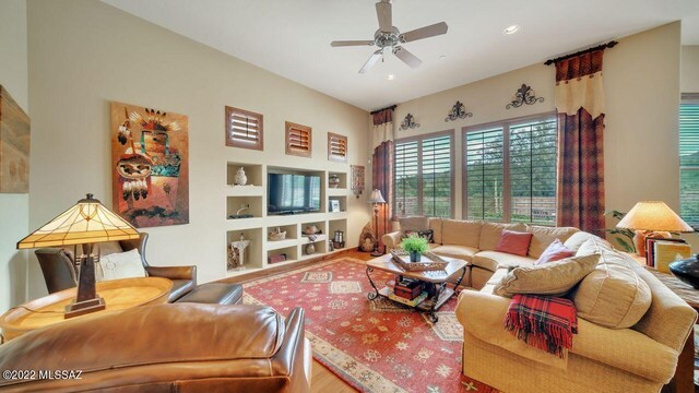 living room with ceiling fan, built in features, and hardwood / wood-style flooring