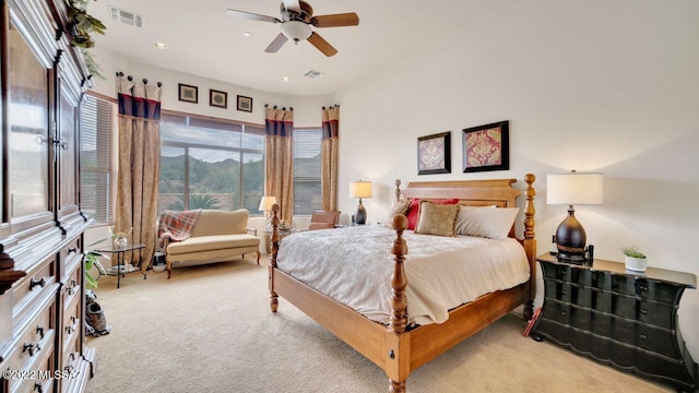 bedroom with ceiling fan and light carpet