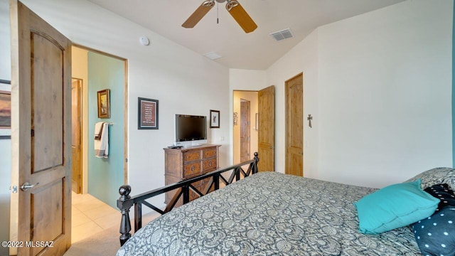 tiled bedroom with ceiling fan