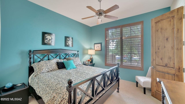 bedroom with light colored carpet and ceiling fan