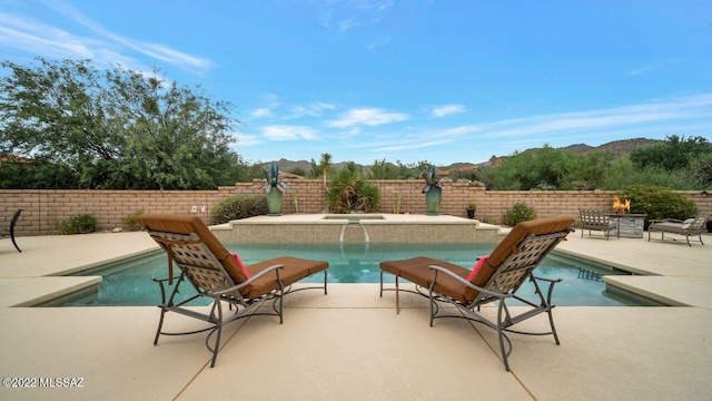 view of swimming pool featuring a patio