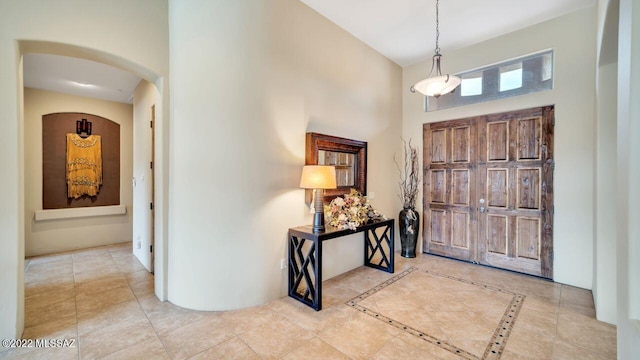 entrance foyer with a towering ceiling