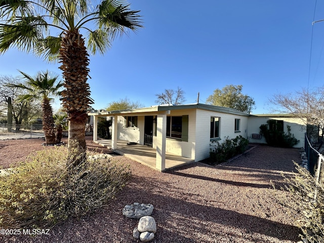 back of property featuring a patio