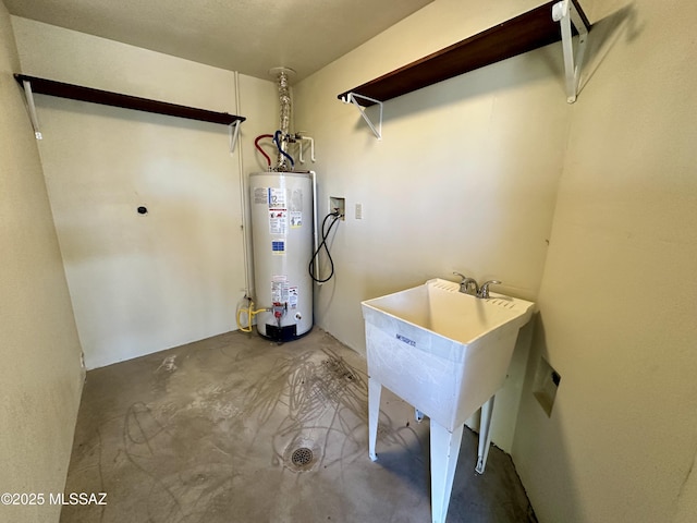 washroom featuring washer hookup, gas water heater, and hookup for an electric dryer