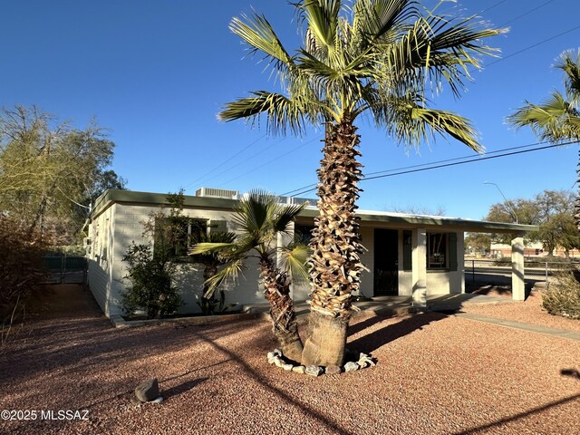 single story home featuring a mountain view and a patio area