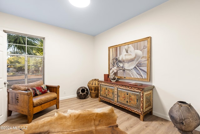 sitting room with light hardwood / wood-style flooring