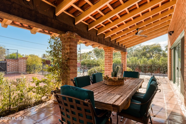 view of patio featuring ceiling fan