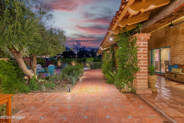 view of patio terrace at dusk