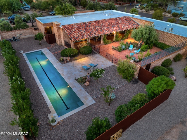 view of swimming pool with a patio