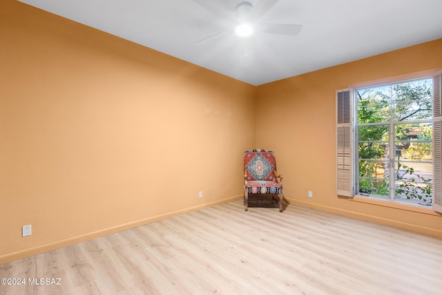 unfurnished room with ceiling fan, light hardwood / wood-style flooring, and plenty of natural light