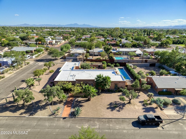 birds eye view of property with a mountain view