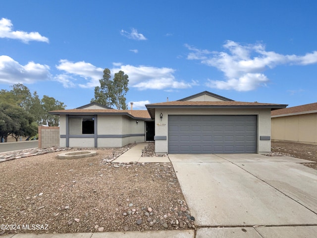 ranch-style house featuring a garage