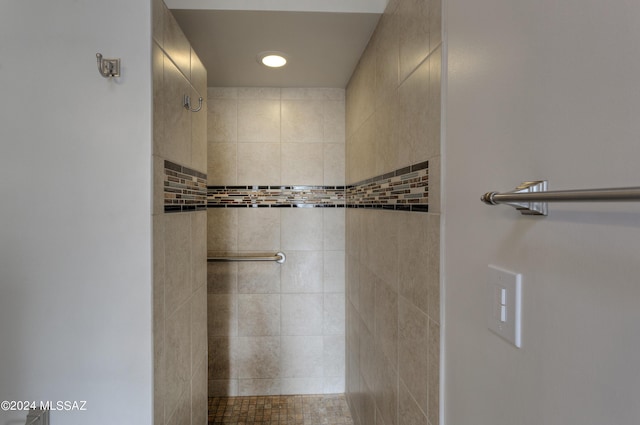 bathroom with a tile shower