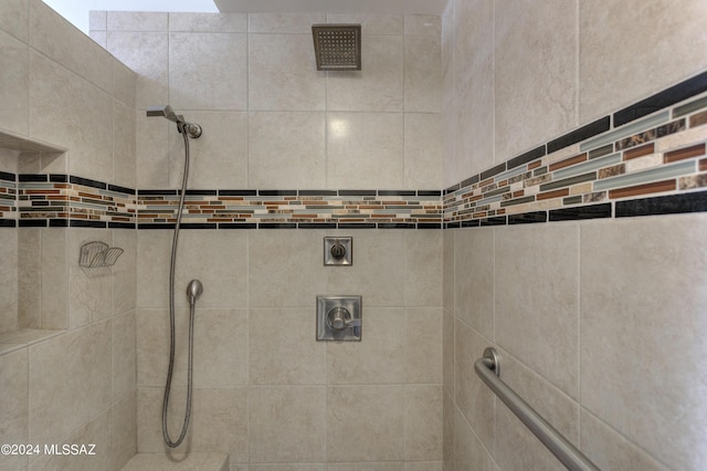 bathroom with a tile shower