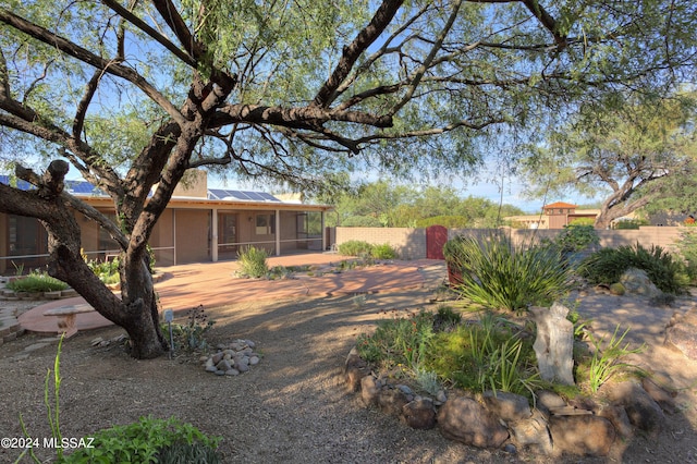 view of yard with a sunroom