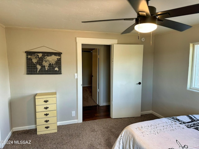bedroom with baseboards, carpet flooring, and a ceiling fan
