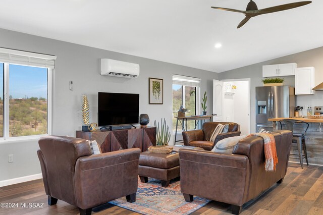 living room featuring vaulted ceiling, dark hardwood / wood-style floors, ceiling fan, and a wall mounted AC