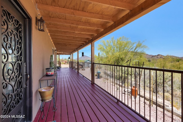 wooden deck featuring a mountain view