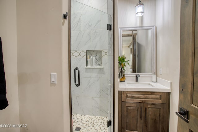 bathroom featuring vanity and an enclosed shower