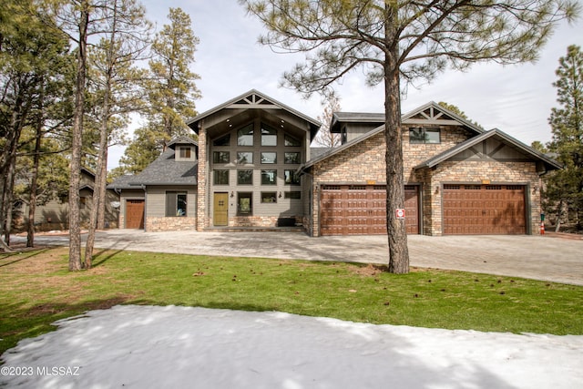 view of front of house with a garage and a front lawn