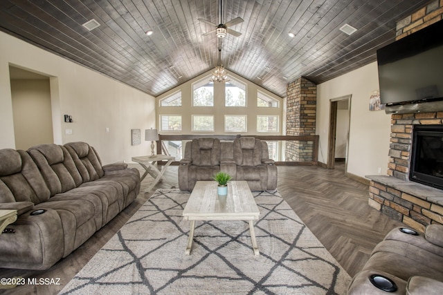 living room featuring parquet floors, ceiling fan, a fireplace, and wood ceiling