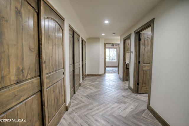 hall with light parquet floors