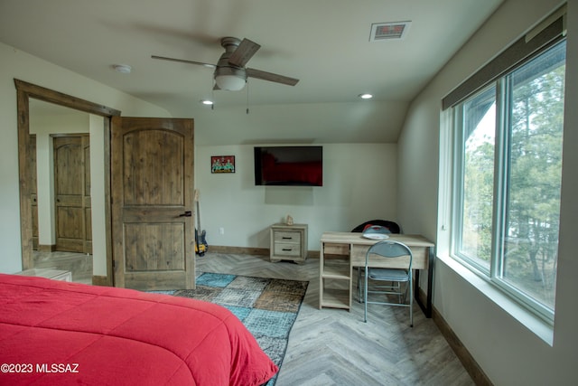 bedroom featuring multiple windows, light parquet floors, ceiling fan, and lofted ceiling