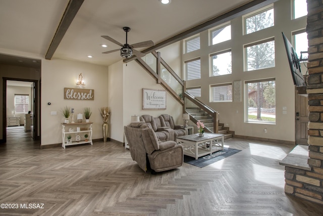 living room with beam ceiling, parquet floors, and ceiling fan