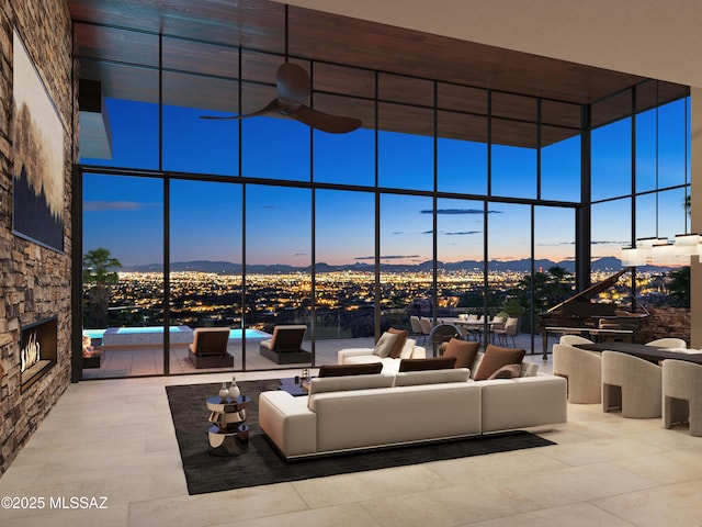 unfurnished living room with a wall of windows and a towering ceiling