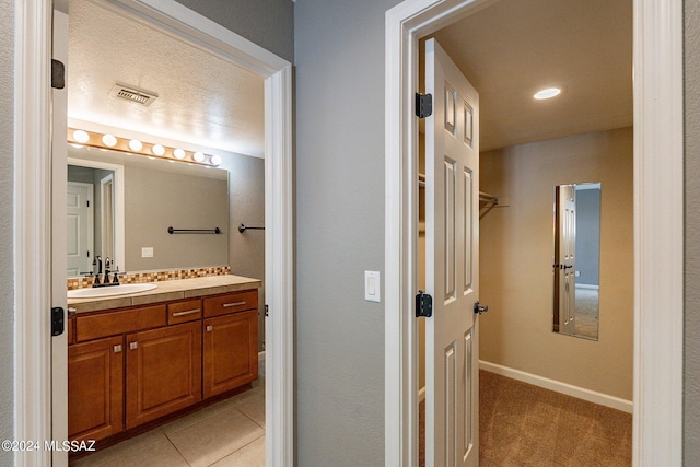 bathroom featuring tile patterned floors and vanity