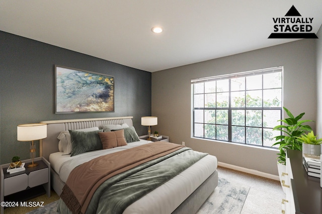 bedroom featuring light carpet