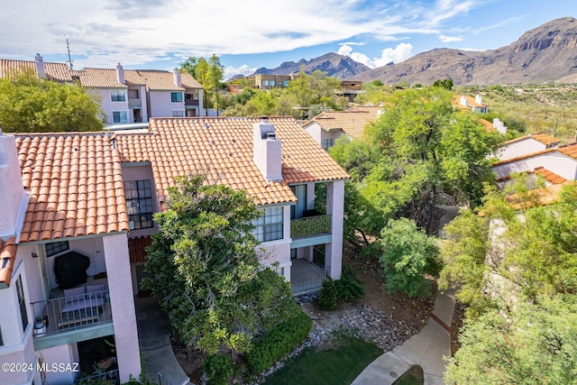 birds eye view of property with a mountain view