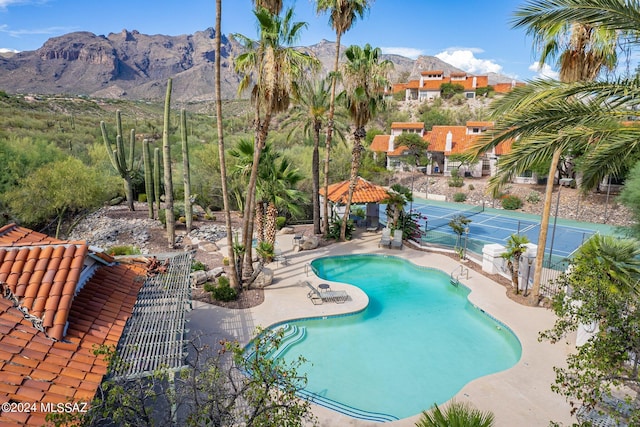 view of pool with a mountain view, a gazebo, and a patio area