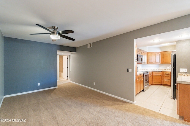 carpeted empty room with ceiling fan