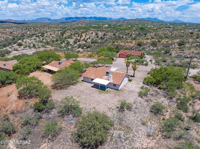 drone / aerial view featuring a mountain view