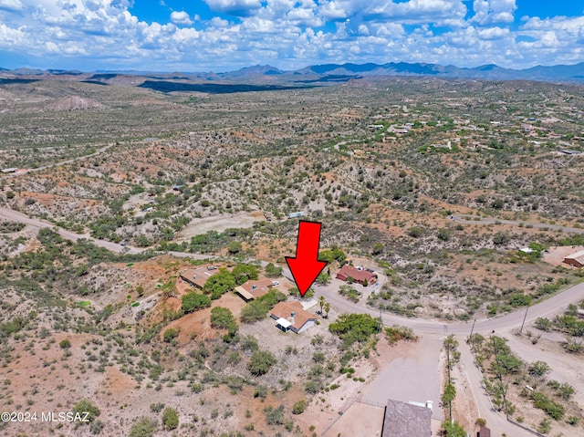 birds eye view of property featuring a mountain view