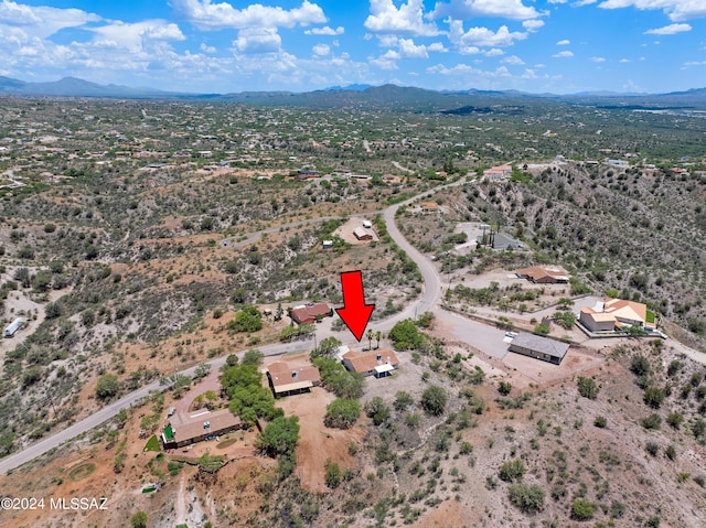bird's eye view with a mountain view and view of desert