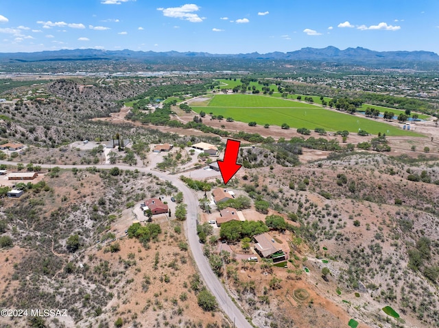 birds eye view of property with a mountain view