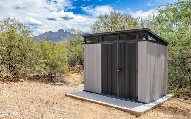 view of outbuilding featuring a mountain view