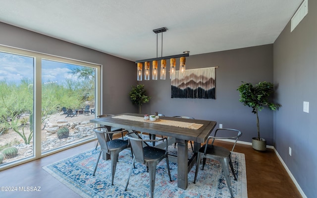 dining room with concrete flooring