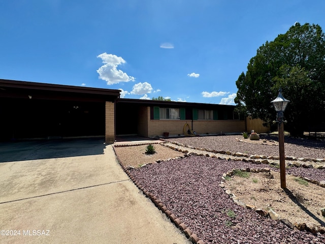 single story home with a carport