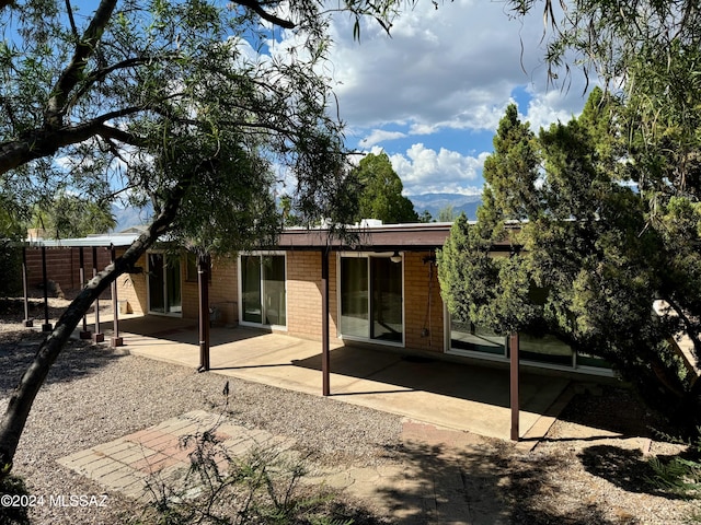 rear view of house featuring a patio area