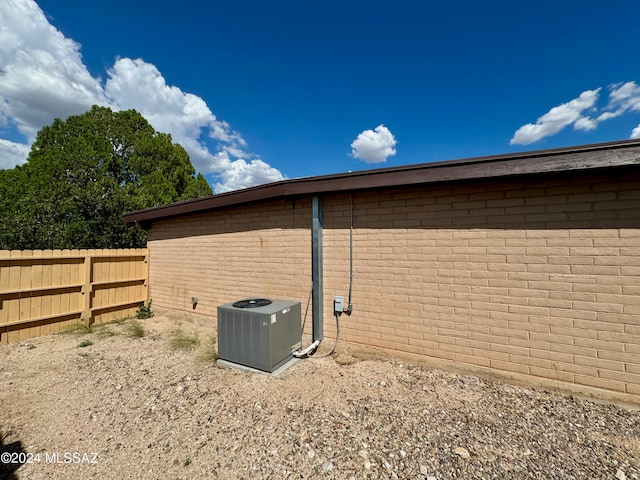 view of side of property featuring central AC unit