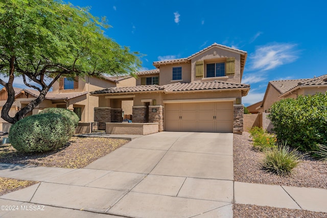 mediterranean / spanish-style house featuring a garage