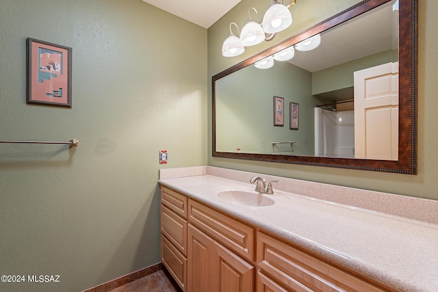 bathroom with tile patterned flooring and vanity