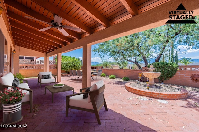 view of patio / terrace with ceiling fan, an outdoor hangout area, and a fenced backyard