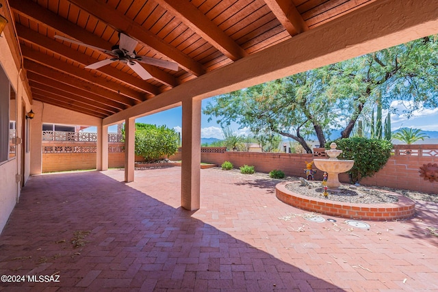 view of patio / terrace featuring a fenced backyard and a ceiling fan